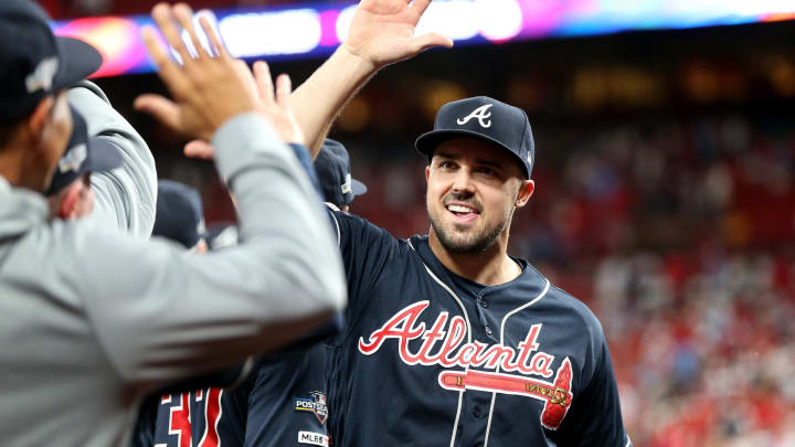 ST LOUIS, MISSOURI – OCTOBER 06: Adam Duvall #23 of the Atlanta Braves celebrates with his teammates. (Photo by Jamie Squire/Getty Images)