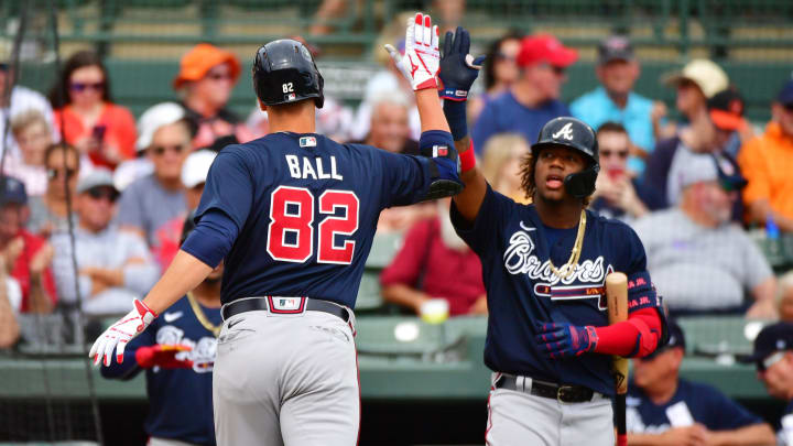SARASOTA, FLORIDA – FEBRUARY 26: Bryce Ball #82 high-five Ronald Acuna Jr. #13 of the Atlanta Braves. (Photo by Julio Aguilar/Getty Images)