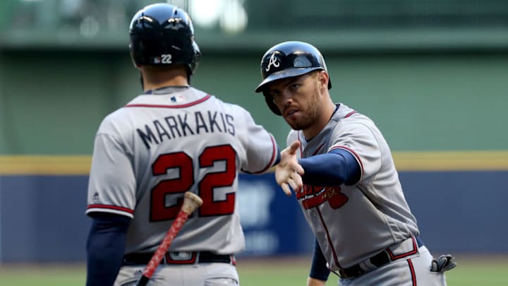 MILWAUKEE, WI - AUGUST 8: Freddie Freeman #5 of the Atlanta Braves is congratulated by Nick Markakis #22 after scoring a run in the fourth inning against the Milwaukee Brewers at Miller Park on August 8, 2016 in Milwaukee, Wisconsin. (Photo by Dylan Buell/Getty Images)