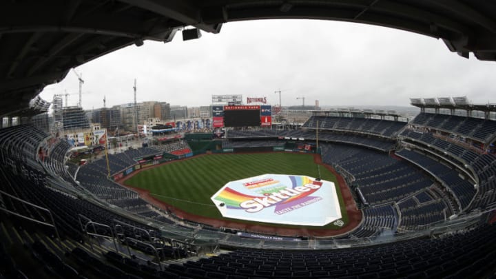 WASHINGTON, DC - JULY 21: A tarp covers the field as rain falls after the Atlanta Braves and Washington Nationals game was postponed due to inclement weather at Nationals Park on July 21, 2018 in Washington, DC. (Photo by Patrick McDermott/Getty Images)