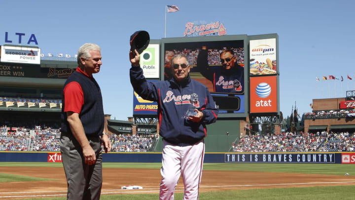Atlanta Braves Manager Bobby Cox seen here getting a trophy commemorating his 2,500th and general manager Frank Wren (on the left) didn’t see eye-to-eye on acquiring Julio Franco back in 2002. (Photo by Mike Zarrilli/Getty Images)