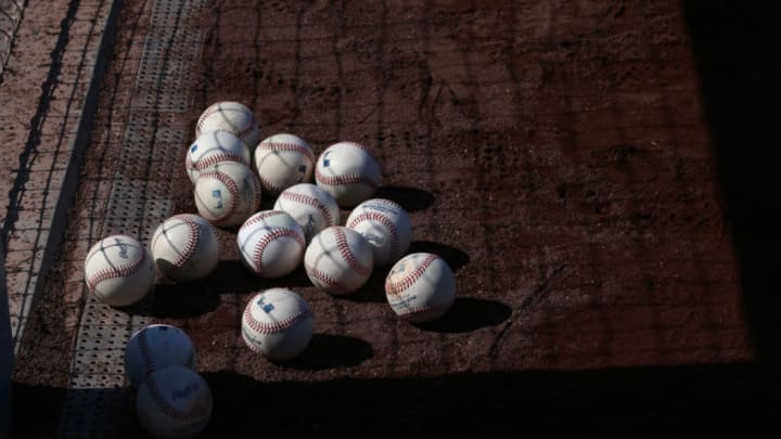 A bunch of baseballs... on the warning track. (Photo by Victor Decolongon/Getty Images) A bunch of baseballs... on the warning track. (Photo by Victor Decolongon/Getty Images)