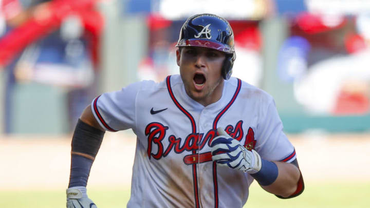 ATLANTA, GA - SEPTEMBER 30: Austin Riley #27 of the Atlanta Braves reacts after hitting a single in the thirteenth inning of Game One of the National League Wild Card Series against the Cincinnati Reds at Truist Park on September 30, 2020 in Atlanta, Georgia. (Photo by Todd Kirkland/Getty Images)