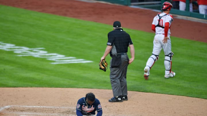 PHILADELPHIA, PA - APRIL 01: Ozzie Albies #1 of the Atlanta Braves sits at home plate after getting tagged out by J.T. Realmuto #10 of the Philadelphia Phillies in the 10th inning on Opening Day at Citizens Bank Park on April 1, 2021 in Philadelphia, Pennsylvania. The Phillies won 3-2. (Photo by Drew Hallowell/Getty Images) PHILADELPHIA, PA - APRIL 01: Ozzie Albies #1 of the Atlanta Braves sits at home plate after getting tagged out by J.T. Realmuto #10 of the Philadelphia Phillies in the 10th inning on Opening Day at Citizens Bank Park on April 1, 2021 in Philadelphia, Pennsylvania. The Phillies won 3-2. (Photo by Drew Hallowell/Getty Images)