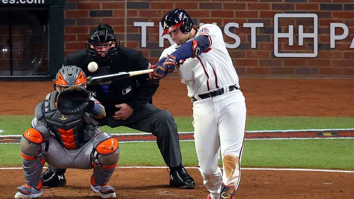 ATLANTA, GEORGIA - OCTOBER 31: Austin Riley #27 of the Atlanta Braves hits a double against the Houston Astros during the fifth inning in Game Five of the World Series at Truist Park on October 31, 2021 in Atlanta, Georgia. (Photo by Todd Kirkland/Getty Images)