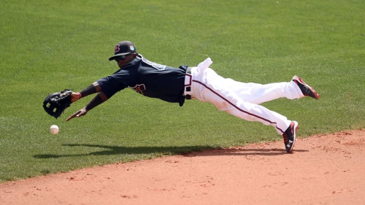 LAKE BUENA VISTA, FL - MARCH 16: Ozzie Albies #87 of the Atlanta Braves dives for a ground ball during the fifth inning of a spring training game against the St. Louis Cardinals at Champion Stadium on March 16, 2016 in Lake Buena Vista, Florida. (Photo by Stacy Revere/Getty Images)