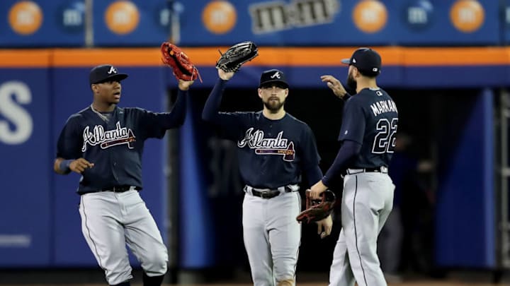 NEW YORK, NY - MAY 02: Ronald Acuna Jr. #13,Ender Inciarte #11 and Nick Markakis #22 of the Atlanta Braves celebrate the 7-0 win over the New York Mets on May 2, 2018 at Citi Field in the Flushing neighborhood of the Queens borough of New York City. (Photo by Elsa/Getty Images)