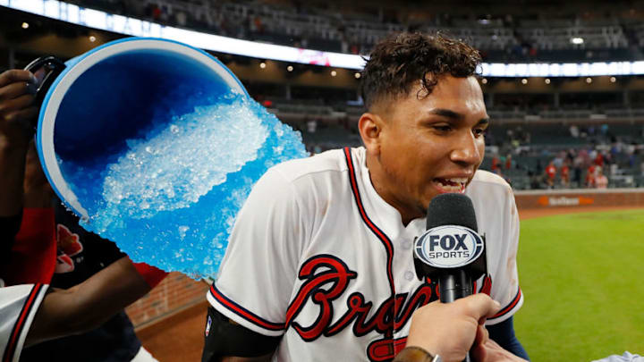 ATLANTA, GA - MAY 29: Johan Camargo #17 of the Atlanta Braves is doused by Ozzie Albies #1 and Julio Teheran #49 after his walk-off homer in the ninth inning of a 7-6 win over the New York Mets at SunTrust Park on May 29, 2018 in Atlanta, Georgia. (Photo by Kevin C. Cox/Getty Images)