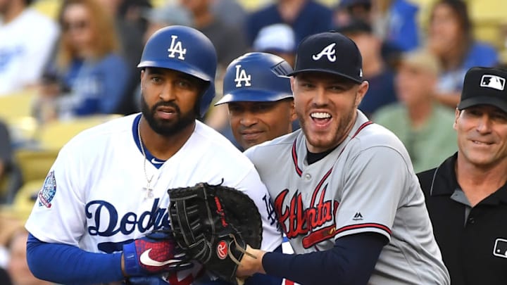 LOS ANGELES, CA - JUNE 08: Matt Kemp #27 of the Los Angeles Dodgers and Freddie Freeman #5 of the Atlanta Braves share a laugh after Kemp singled in the first inning at Dodger Stadium on June 8, 2018 in Los Angeles, California. (Photo by Jayne Kamin-Oncea/Getty Images)