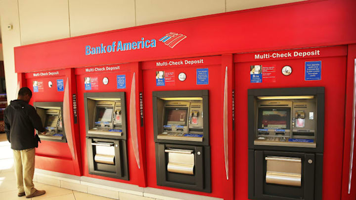 NEW YORK, NY - APRIL 16: A man uses an ATM at a Bank of America branch on April 16, 2014 in New York City. As the nation's second-largest bank continues to struggle with fallout from the financial crisis, Bank of America reported a $276 million first-quarter loss Wednesday. (Photo by Spencer Platt/Getty Images)
