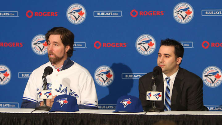 TORONTO, CANADA - JANUARY 8: R.A. Dickey #43 (L) of the Toronto Blue Jays is introduced at a press conference as general manager Alex Anthopoulos looks on at Rogers Centre on January 8, 2013 in Toronto, Ontario, Canada. (Photo by Tom Szczerbowski/Getty Images)