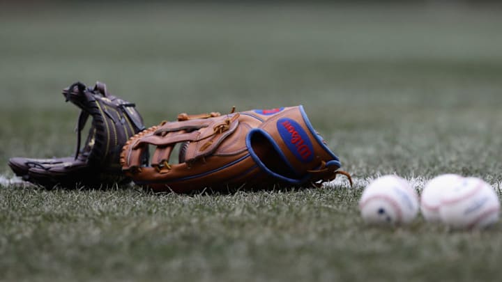 CHICAGO, IL - APRIL 13: Gloves and balls are seen on the field before the Chicago Cubs take on the Atlanta Braves at Wrigley Field on April 13, 2018 in Chicago, Illinois. The Braves defeated the Cubs 4-0. (Photo by Jonathan Daniel/Getty Images) CHICAGO, IL - APRIL 13: Gloves and balls are seen on the field before the Chicago Cubs take on the Atlanta Braves at Wrigley Field on April 13, 2018 in Chicago, Illinois. The Braves defeated the Cubs 4-0. (Photo by Jonathan Daniel/Getty Images)