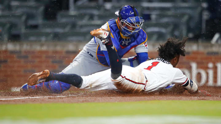 ATLANTA, GA - APRIL 4: Ozzie Albies #1 of the Atlanta Braves is tagged out at home by Willson Contreras #40 of the Chicago Cubs in the fourth inning of an MLB game at SunTrust Park on April 4, 2018 in Atlanta, Georgia. (Photo by Todd Kirkland/Getty Images)
