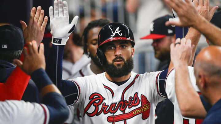 ATLANTA, GA – APRIL 13: Nick Markakis #22 of the Atlanta Braves is congratulated in the dugout after hitting a home run against the New York Mets during the fourth inning at SunTrust Park on April 13, 2019 in Atlanta, Georgia. (Photo by John Amis/Getty Images)