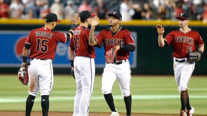 PHOENIX, AZ – APRIL 14: Ketel Marte #4 and Tim Locastro #16 of the Arizona Diamondbacks are congratulated by teammates Ildemaro Vargas #15 and Nick Ahmed #13 following an 8-4 victory against the San Diego Padres during an MLB game at Chase Field on April 14, 2019 in Phoenix, Arizona. (Photo by Ralph Freso/Getty Images)