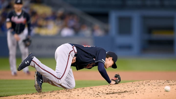 LOS ANGELES, CALIFORNIA – MAY 07: Max  Fried #54 of the Atlanta Braves falls after he is hit on a comebacker by Alex Verdugo #27 of the Los Angeles Dodgers during the second inning at Dodger Stadium on May 07, 2019 in Los Angeles, California. (Photo by Harry How/Getty Images)