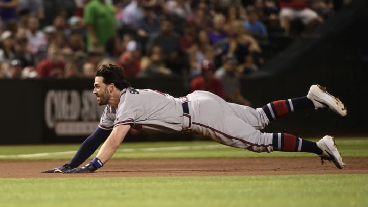 PHOENIX, ARIZONA – MAY 10: Dansby Swanson #7 of the Atlanta Braves dives for a triple in the fourth inning of the MLB game against the Arizona Diamondbacks at Chase Field on May 10, 2019 in Phoenix, Arizona. (Photo by Jennifer Stewart/Getty Images)