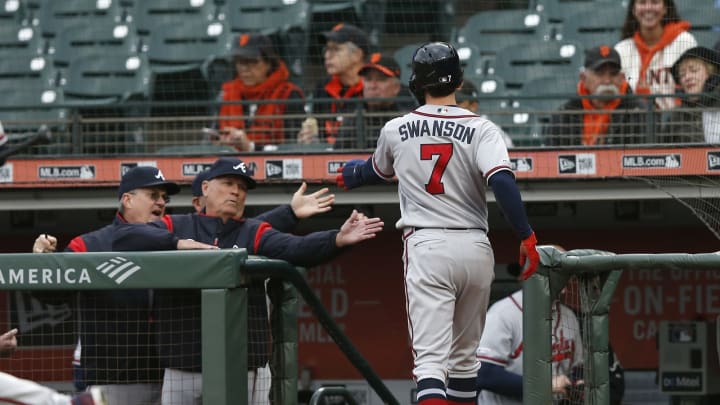 SAN FRANCISCO, CALIFORNIA – MAY 21: Dansby Swanson #7 of the Atlanta Braves celebrates with manager Brian Snitker #43 after scoring on a double off the bat of Nick Markakis in the top of the first inning against the San Francisco Giants at Oracle Park on May 21, 2019 in San Francisco, California. (Photo by Lachlan Cunningham/Getty Images)