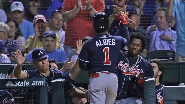 CHICAGO, ILLINOIS – JUNE 25: Ozzie Albies #1 of the Atlanta Bravesis greeted at dugout by coaches and teammates after hitting a two run home run in the 7th inning against the Chicago Cubs at Wrigley Field on June 25, 2019 in Chicago, Illinois. The Braves defeated the Cubs 3-2. (Photo by Jonathan Daniel/Getty Images)