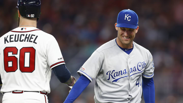 ATLANTA, GEORGIA – JULY 23: Pitcher Danny Duffy #41 of the Kansas City Royals (right) laughs with pitcher Dallas Keuchel #60 of the Atlanta Braves at the end of the fifth inning after Keuchel led off the inning with a stand up double during the game at SunTrust Park on July 23, 2019 in Atlanta, Georgia. (Photo by Mike Zarrilli/Getty Images)