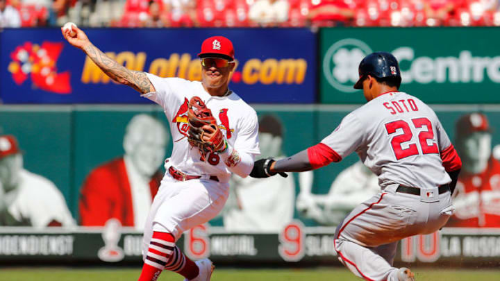 ST LOUIS, MO - SEPTEMBER 18: Kolten Wong #16 of the St. Louis Cardinals attempts to turn a double play against Juan Soto #22 of the Washington Nationals in the sixth inning at Busch Stadium on September 18, 2019 in St Louis, Missouri. (Photo by Dilip Vishwanat/Getty Images)