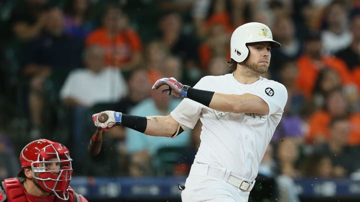 HOUSTON, TEXAS – AUGUST 25: Josh Reddick #22 of the Houston Astros doubles in two runs in the eighth inning against the Los Angeles Angels at Minute Maid Park on August 25, 2019 in Houston, Texas. Teams are wearing special color schemed uniforms with players choosing nicknames to display for Players’ Weekend. (Photo by Bob Levey/Getty Images)