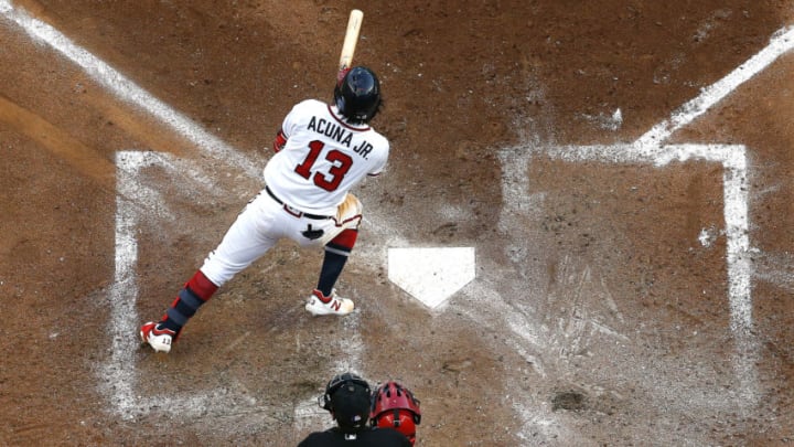 ATLANTA, GEORGIA - OCTOBER 03: Ronald Acuna Jr. #13 of the Atlanta Braves hits a fifth inning double against the St. Louis Cardinals in game one of the National League Division Series at SunTrust Park on October 03, 2019 in Atlanta, Georgia. (Photo by Kevin C. Cox/Getty Images)