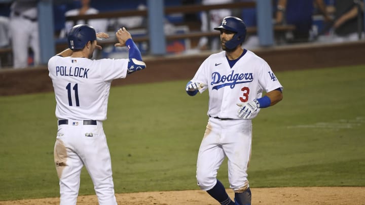 LOS ANGELES, CA – SEPTEMBER 06: Chris Taylor #3 of the Los Angeles Dodgers is congratulated by A.J. Pollock #11 (Photo by Kevork Djansezian/Getty Images)