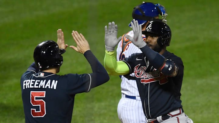 Marcell Ozuna of the Atlanta Braves celebrates with Freddie Freeman. (Photo by Sarah Stier/Getty Images)