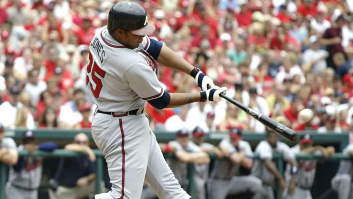 ST. LOUIS – AUGUST 6: Outfielder Andruw  Jones #25 of the Atlanta Braves hits a grand-slam home run against the St. Louis Cardinals on August 6, 2005 at Busch Stadium in St. Louis, Missouri. The Braves defeated the Cardinals 8-1. (Photo by Dilip Vishwanat/Getty Images)