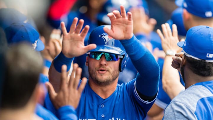 CLEVELAND, OH - MAY 3: Josh Donaldson #20 of the Toronto Blue Jays celebrates after scoring off a single by Yangervis Solarte #26 during the fourth inning against the Cleveland Indians at Progressive Field on May 3, 2018 in Cleveland, Ohio. All players are wearing #42 in honor of Jackie Robinson Day in this makeup game from April 15. (Photo by Jason Miller/Getty Images)