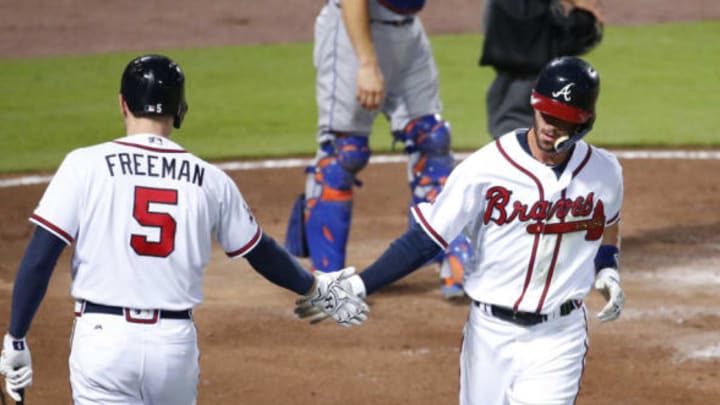 Sep 9, 2016; Atlanta, GA, USA; Atlanta Braves shortstop Dansby Swanson (2) celebrates a run with first baseman Freddie Freeman (5) off of a RBI single by third baseman Adonis Garcia (not pictured) in the fifth inning of their game against the New York Mets at Turner Field. Mandatory Credit: Jason Getz-USA TODAY Sports