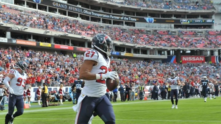 Dec 27, 2015; Nashville, TN, USA; Houston Texans strong safety Quintin Demps (27) picks up the ball fumbled by Tennessee Titans running back Antonio Andrews (26) (not pictured) and runs for a touchdown during the first half at Nissan Stadium. Mandatory Credit: Jim Brown-USA TODAY Sports