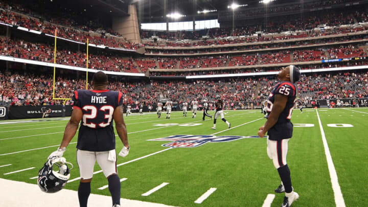 HOUSTON, TEXAS - OCTOBER 06: Carlos Hyde #23 and Duke Johnson #25 of the Houston Texans celebrate an interception returned for a touchdown by Tashaun Gipson #39 in the foruth quarter against the Atlanta Falcons at NRG Stadium on October 06, 2019 in Houston, Texas. (Photo by Mark Brown/Getty Images)