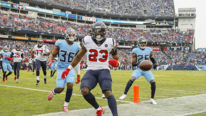 NASHVILLE, TENNESSEE - DECEMBER 15: Carlos Hyde #23 of the Houston Texans runs into the end zone for a touchdown against LeShaun Sims #36 of the Tennessee Titans during the second half at Nissan Stadium on December 15, 2019 in Nashville, Tennessee. (Photo by Frederick Breedon/Getty Images)