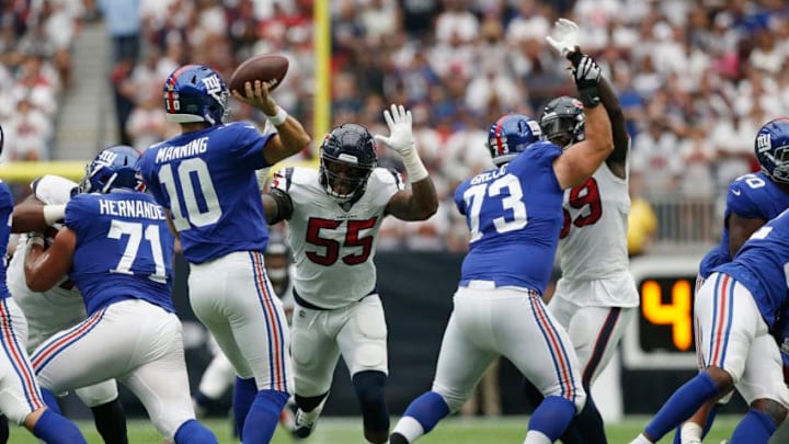 HOUSTON, TX - SEPTEMBER 23: Eli Manning #10 of the New York Giants passes the ball pressured by Benardrick McKinney #55 of the Houston Texans in the second quarter at NRG Stadium on September 23, 2018 in Houston, Texas. (Photo by Tim Warner/Getty Images)