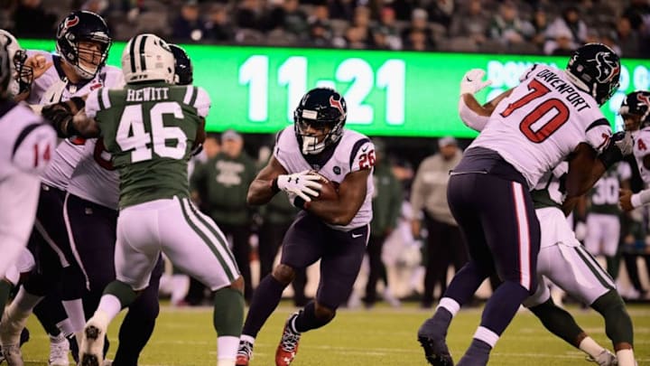 EAST RUTHERFORD, NJ - DECEMBER 15: Running back Lamar Miller #26 of the Houston Texans runs the ball against the New York Jets in the first quarter at MetLife Stadium on December 15, 2018 in East Rutherford, New Jersey. (Photo by Steven Ryan/Getty Images)