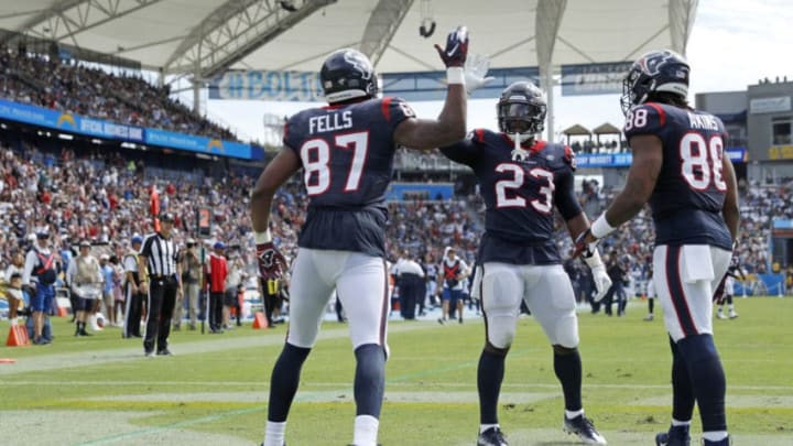 CARSON, CALIFORNIA - SEPTEMBER 22: Tight end Darren Fells #87 of the Houston Texans celebrates his touchdown in the second quarter against the Los Angeles Chargers with running back Carlos Hyde #23 and tight end Jordan Akins #88 at Dignity Health Sports Park on September 22, 2019 in Carson, California. (Photo by Meg Oliphant/Getty Images)