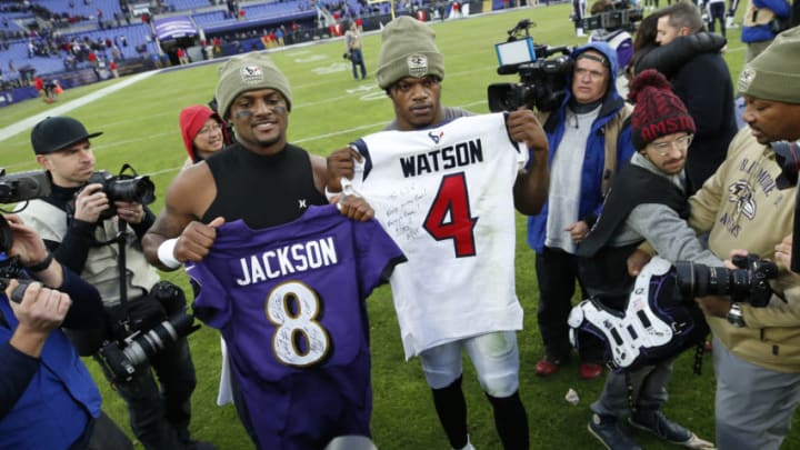 BALTIMORE, MARYLAND - NOVEMBER 17: Quarterback Lamar Jackson #8 of the Baltimore Ravens exchange jerseys with quarterback Deshaun Watson #4 of the Houston Texans after the Baltimore Ravens 41-7 win over the Houston Texans at M&T Bank Stadium on November 17, 2019 in Baltimore, Maryland. (Photo by Todd Olszewski/Getty Images)