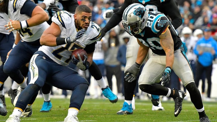 CHARLOTTE, NC – DECEMBER 11: Kenneth Farrow #27 of the San Diego Chargers loses his helmet and keeps running against Kurt Coleman #20 of the Carolina Panthers in the 3rd quarter during the game at Bank of America Stadium on December 11, 2016 in Charlotte, North Carolina. (Photo by Grant Halverson/Getty Images)