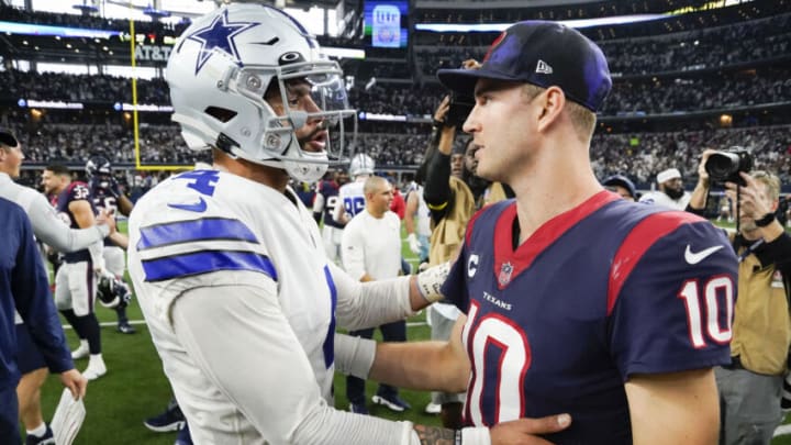 Dec 11, 2022; Arlington, Texas, USA; Dallas Cowboys quarterback Dak Prescott (4) with Houston Texans quarterback Davis Mills (10) following a game at AT&T Stadium. Mandatory Credit: Raymond Carlin III-USA TODAY Sports