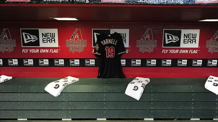 Jul 7, 2013; Phoenix, AZ, USA; Arizona Diamondbacks jersey to support the nineteen firefighters lost in the fire in the town of Yarnell hangs in the dugout during the game against the Colorado Rockies at Chase Field. Mandatory Credit: Jennifer Hilderbrand-USA TODAY Sports