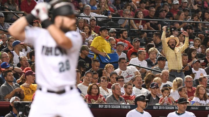 PHOENIX, AZ - SEPTEMBER 06: A fan cheers as Steven Souza Jr. #28 of the Arizona Diamondbacks stands at bat in the fourth inning of the MLB game against the Atlanta Braves at Chase Field on September 6, 2018 in Phoenix, Arizona. (Photo by Jennifer Stewart/Getty Images)