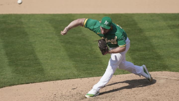 OAKLAND, CALIFORNIA - SEPTEMBER 30: Liam Hendriks #16 of the Oakland Athletics pitches against the Chicago White Sox during the ninth inning of Game Two of the American League Wild Card Round at RingCentral Coliseum on September 30, 2020 in Oakland, California. (Photo by Thearon W. Henderson/Getty Images)