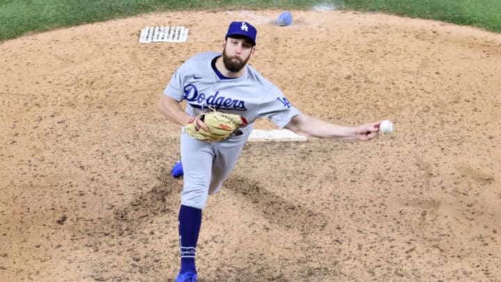 ARLINGTON, TEXAS - OCTOBER 24: Adam Kolarek #56 of the Los Angeles Dodgers pitches against the Tampa Bay Rays during the eighth inning in Game Four of the 2020 MLB World Series at Globe Life Field on October 24, 2020 in Arlington, Texas. (Photo by Maxx Wolfson/Getty Images)