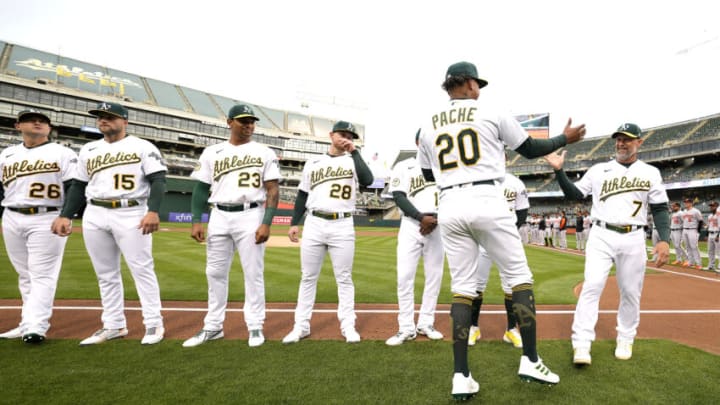 OAKLAND, CALIFORNIA - APRIL 18: Cristian Pache #20 of the Oakland Athletics greets manager Mark Kotsay #7 and teammates during player introduction prior to the start of their home opener against the Baltimore Orioles at RingCentral Coliseum on April 18, 2022 in Oakland, California. (Photo by Thearon W. Henderson/Getty Images) OAKLAND, CALIFORNIA - APRIL 18: Cristian Pache #20 of the Oakland Athletics greets manager Mark Kotsay #7 and teammates during player introduction prior to the start of their home opener against the Baltimore Orioles at RingCentral Coliseum on April 18, 2022 in Oakland, California. (Photo by Thearon W. Henderson/Getty Images)