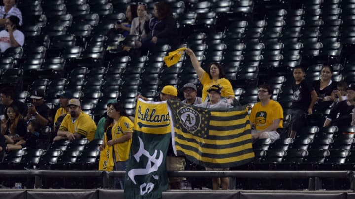 CHICAGO, IL - SEPTEMBER 8: Oakland Athletics fans cheer during the twelfth inning against the Chicago White Sox at U.S. Cellular Field on September 8, 2014 in Chicago, Illinois. The White Sox defeated the Athletics 5-4 in 12 innings. (Photo by Brian D. Kersey/Getty Images)