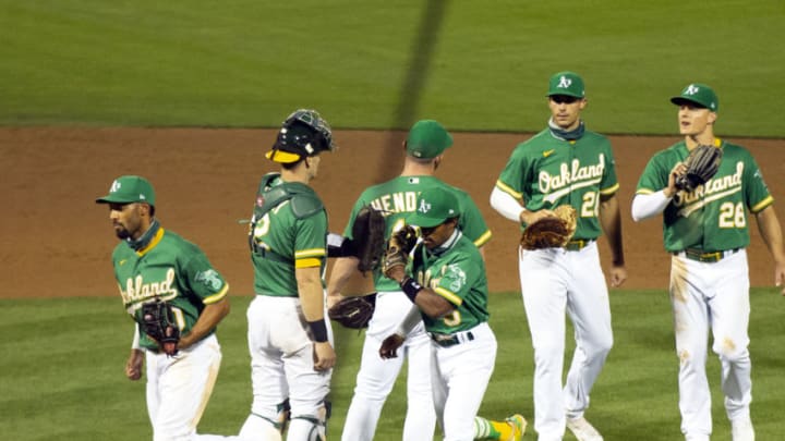 Aug 19, 2020; Oakland, California, USA; Oakland Athletics players celebrate their teamÕs 4-1 victory over the Arizona Diamondbacks in a baseball game at Oakland Coliseum. Mandatory Credit: D. Ross Cameron-USA TODAY Sports