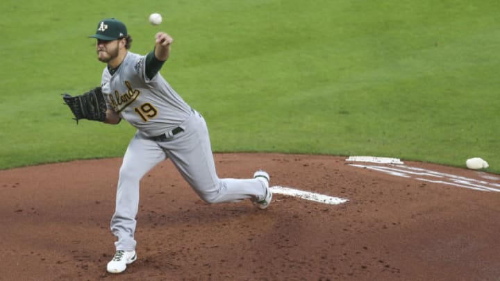Apr 8, 2021; Houston, Texas, USA; Oakland Athletics starting pitcher Cole Irvin (19) pitches against the Houston Astros during the second inning at Minute Maid Park. Mandatory Credit: Thomas Shea-USA TODAY Sports