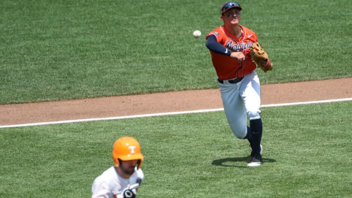 Jun 20, 2021; Omaha, Nebraska, USA; Virginia Cavaliers infielder Zack Gelof (18) throws out Tennessee Volunteers catcher Connor Pavolony (17) on a sacrifice bunt in the fifth inning at TD Ameritrade Park. Mandatory Credit: Steven Branscombe-USA TODAY Sports